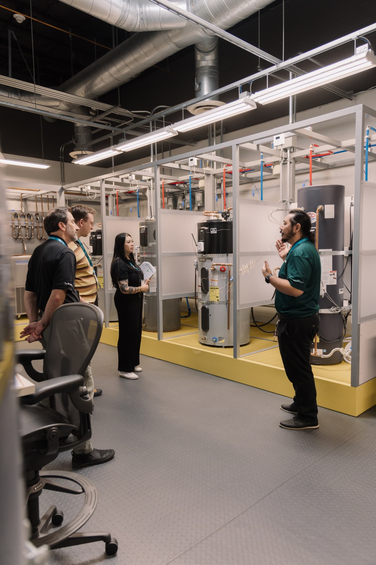 A demonstration among water heaters in a training lab